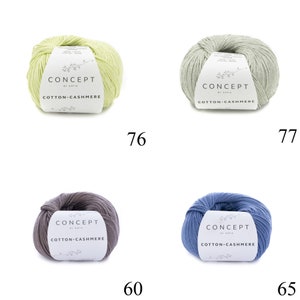 May include: Four balls of yarn in different colors: light green, gray, light blue, and brown. Each ball has a label that reads "CONCEPT by Katia COTTON-CASHMERE".