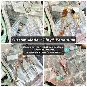 May include: Four different custom-made "Tiny" pendulums featuring a variety of crystals and charms. The pendulums are made with a silver chain and a selection of crystals, including amethyst, rose quartz, and clear quartz. The charms include a star, a fish, a flower, and a crescent moon.