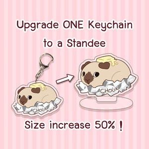 May include: Upgrade a keychain to a standee! A cartoon illustration of a brown and white guinea pig with a yellow pat of butter on its back, sitting in a silver foil wrapper. The standee is 50% larger than the keychain.