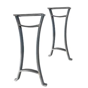 May include: Two metal table legs with a curved design. The legs are made of a dark gray metal and have a flat top surface.