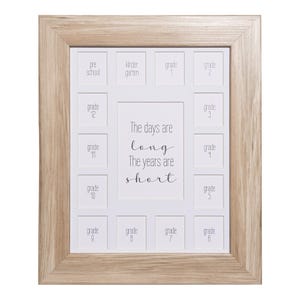 May include: A wooden picture frame with 16 openings for photos. The frame is designed to hold photos from each year of a child's school years, from preschool to grade 12. The frame has the text "The days are long, The years are short" printed on it.
