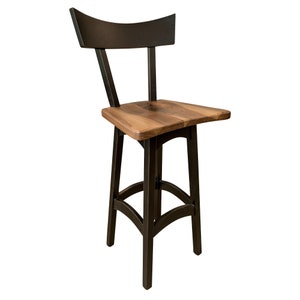 May include: A black bar stool with a wood seat and a curved back.