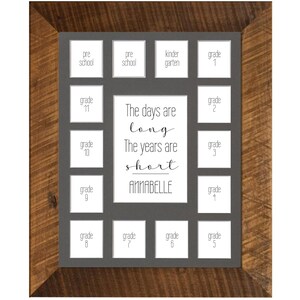 May include: A wooden framed photo display with a gray background. The display has spaces for photos labeled "pre school" through "grade 11". The center has the text "The days are long, The years are short, ANNABELLE".