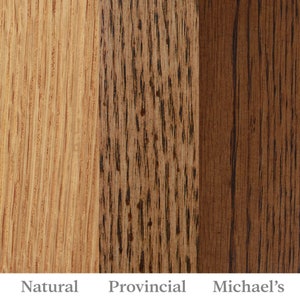 May include: Three wood samples showing different stain colors: Natural, Provincial, and Michael's. The samples are arranged vertically, with the Natural sample on the left, the Provincial sample in the middle, and the Michael's sample on the right.