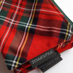 May include: Red, green, and white plaid fabric with a black label that says "JESSIESTYLE".