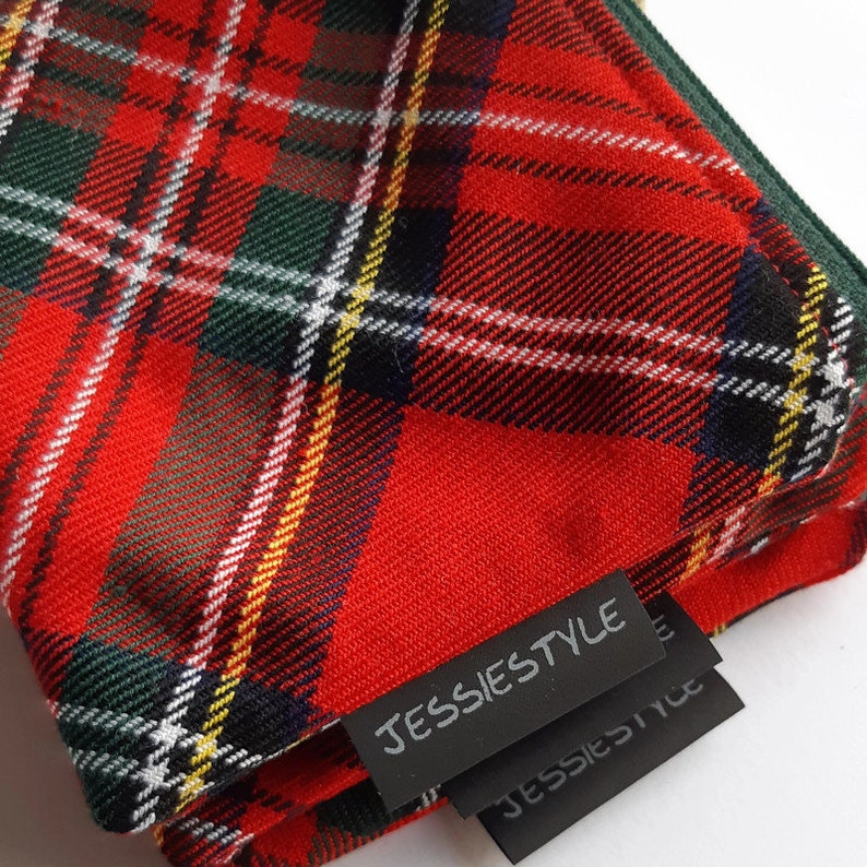 May include: Red, green, and white plaid fabric with a black label that says "JESSIESTYLE".