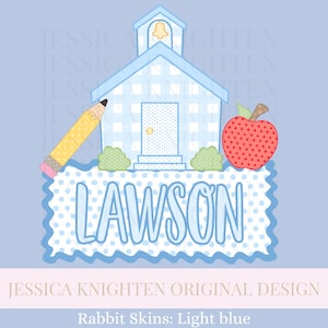 May include: A light blue schoolhouse design with a pencil and apple. The schoolhouse has a bell tower and a door. The name "LAWSON" is written in light blue letters on a blue polka dot background. The design is on a light blue background.