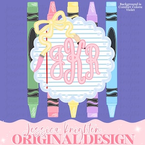 May include: A digital graphic featuring five vertical crayons in green, pink, yellow, purple, and blue behind a scalloped circular frame with blue horizontal stripes. A yellow ribbon bow and the pink monogram letters JKR are centered.