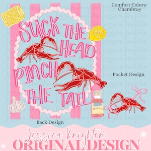May include: A graphic design with a light blue background and pink stripes. The design features red crawfish, a lemon, corn, garlic, and a bottle labeled "Crab Boil." Text reads "Suck the Head, Pinch the Tail."