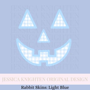 May include: A light blue Jack-o'-lantern face design with a gingham pattern. The design includes triangular eyes and a triangular nose, with a curved mouth. The text "JESSICA KNIGHTEN ORIGINAL DESIGN" and "Rabbit Skins: Light Blue" are also present.