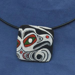 Northwest Indigenous Raven Art jewelry, hand painted on lightweight gourd piece, wearable as pendant or pin