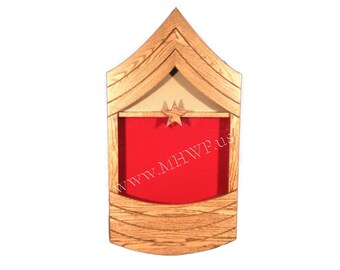 May include: A wooden shadow box with a red felt interior and a gold star. The box is stained in a medium oak colour. The text "www.MHWp.us" is printed on the box.