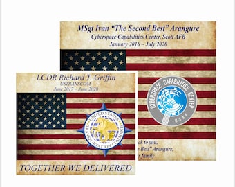 May include: Three cards with an American flag design. The cards feature text including names, titles, and dates. One card has the text "TOGETHER WE DELIVERED". Another card has a logo that says "CYBERSPACE CAPABILITIES CENTER".