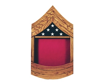 May include: A wooden shadow box with a red felt interior and a five-pointed star design in the top section. The box is stained in a medium oak colour.