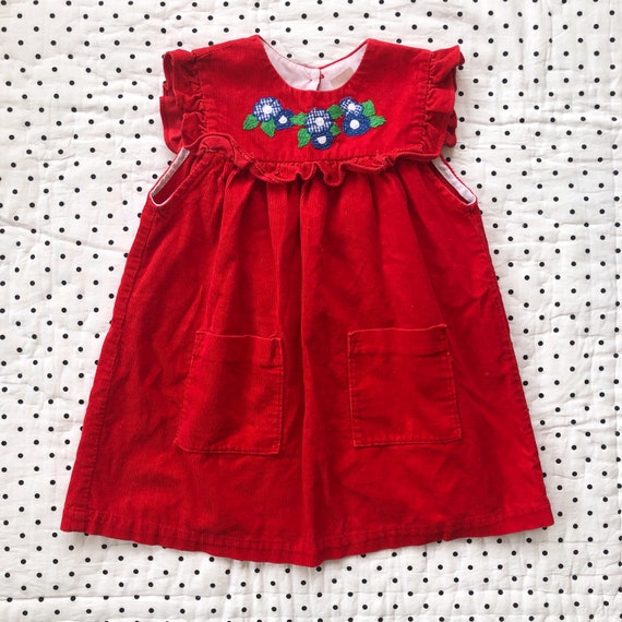 girls red pinafore