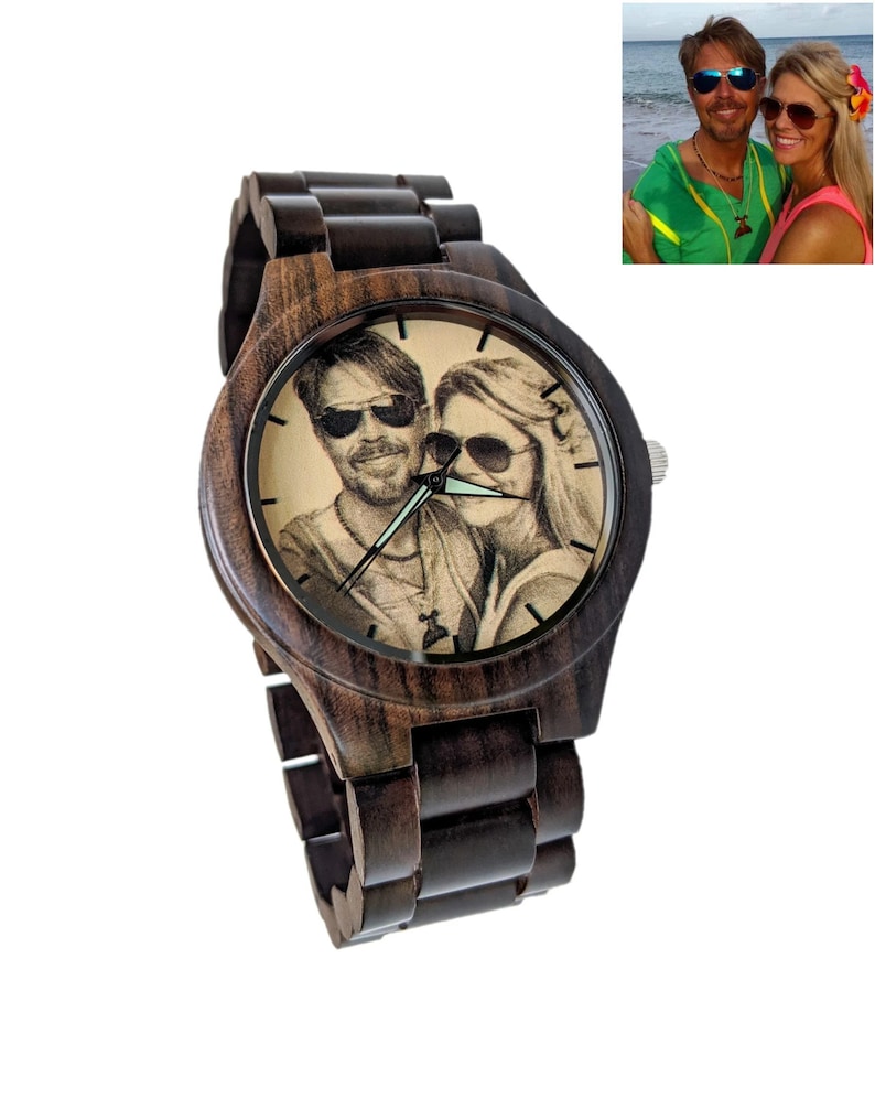 May include: A dark brown wooden wristwatch with a round face. The watch face displays a sepia-toned image of a couple wearing sunglasses. The watch strap is made of matching dark brown wood. A personalized gift.