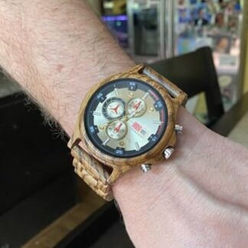 wooden watch on a hand
