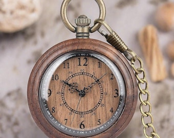 May include: A brown wooden pocket watch with a gold chain. The watch face has a wood grain design and black Roman numeral hour markers.