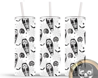 May include: Three white tumblers with a black and white Halloween pattern of skeletons in coffins, bats, and spiderwebs. The tumblers have a straw in each and are on a white background.