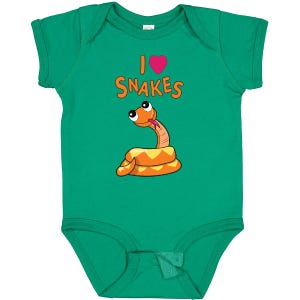 May include: A green baby bodysuit with the text "I ♥ Snakes" and a cartoon snake illustration. The snake is orange and yellow with a pink tongue. The heart is pink.
