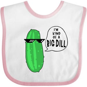 May include: White baby bib with a pink trim. The bib features a cartoon green pickle wearing pixelated sunglasses. A speech bubble says "I'M KIND OF A BIG DILL" in black text. The bib is designed for babies and infants.