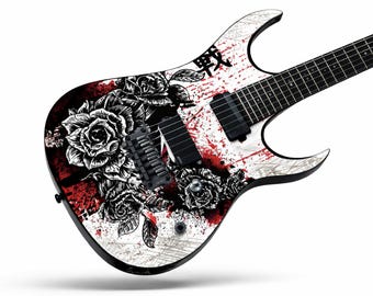 May include: An electric guitar featuring a white body with a black and red graphic print of roses and ink splatters. The design includes the Japanese kanji character for war, two black humbucker pickups, a black bridge, and a black fretboard.