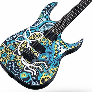 May include: An electric guitar featuring a black body covered in a vibrant, intricate pattern of swirling lines, geometric shapes, and floral-inspired motifs in bright shades of cyan, yellow, and white, with two black pickups and a black bridge.