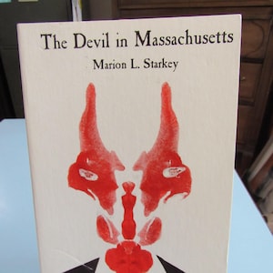 May include: The Devil in Massachusetts by Marion L. Starkey, a book cover with a red inkblot illustration of a devil wearing a black suit and white collar.