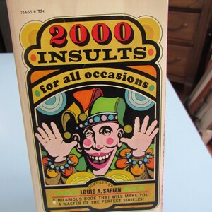 May include: A book cover with a colorful illustration of a jester with a red hat and a big smile. The title of the book is "2000 Insults for all occasions" and the author is Louis A. Safian.