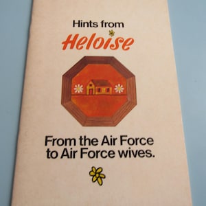 May include: A vintage booklet titled "Hints from Heloise" with text in black and red. The cover features a geometric design with a house illustration and the text "From the Air Force to Air Force wives."