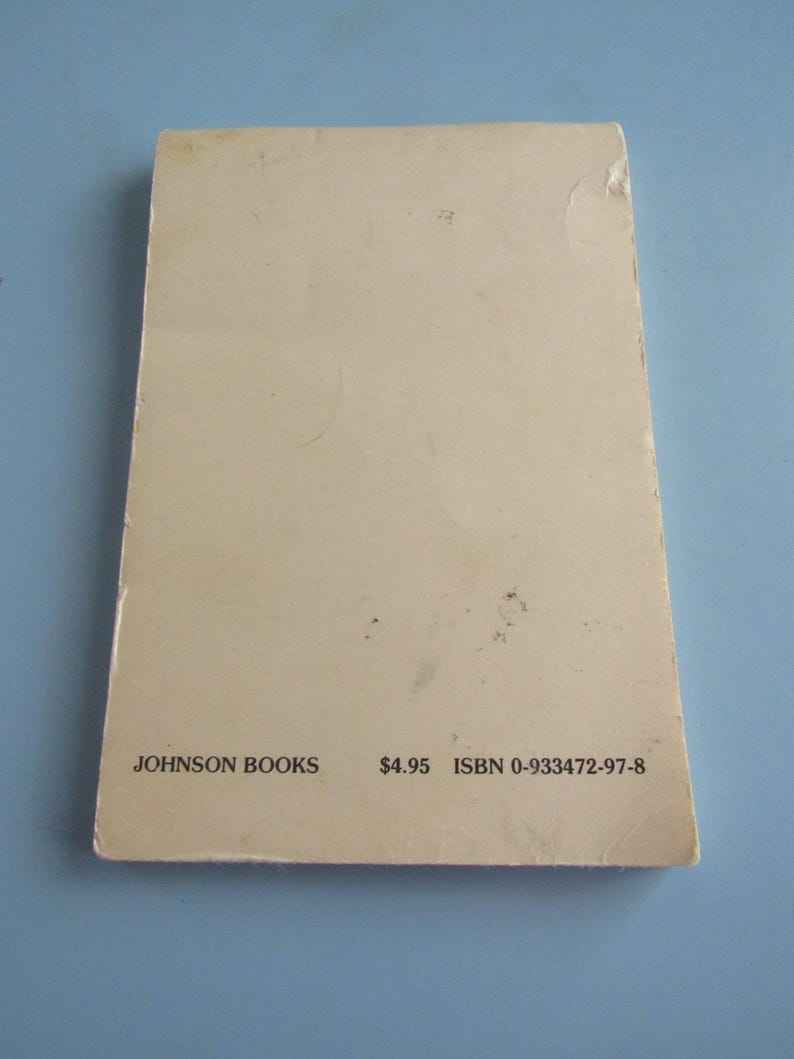 May include: A rectangular book cover with a light beige color. The text "JOHNSON BOOKS" is printed in black at the bottom left, with "ISBN 0-933472-97-8" on the right. The cover has minor wear and tear.