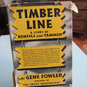 May include: Vintage book titled "Timber Line" with yellow and black text on a gray background. The cover features the subtitle "A Story of Bonfils and Tammen" and the author's name, Gene Fowler.