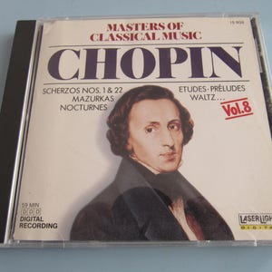 May include: A CD case featuring a portrait of Frédéric Chopin. The cover reads "MASTERS OF CLASSICAL MUSIC" and "CHOPIN" in large letters. The CD includes Scherzos, Mazurkas, Nocturnes, Etudes, Préludes, and Waltz. The CD is labeled "Vol. 8" and has a digital recording time of 59 minutes.