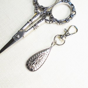 Silver teardrop zipper pull or scissor fob