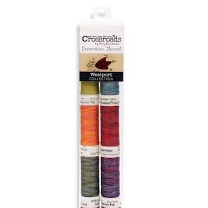 May include: A package of decorative thread from the Crossroads Westport Collection. The package contains six spools of colorful thread in shades of green, orange, red, and purple. The packaging has the brand name and collection name printed on it.