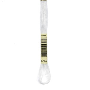 May include: A white embroidery floss skein with a yellow label that reads "3318D45R" and "BLANC".