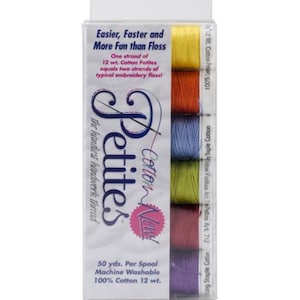 May include: A clear plastic container holding six spools of colorful cotton embroidery thread. The thread colors include yellow, orange, blue, green, pink, and purple. The packaging reads "Petites Cotton New!" and "Easier, Faster and More Fun than Floss."