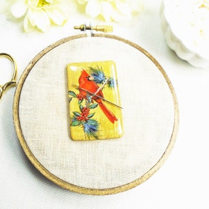 Cardinal needle minder