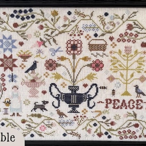 May include: Cross-stitch sampler in a black frame, featuring floral and geometric patterns. The design includes a central vase with the word "PEACE" below it. Other elements include birds, a dog, and the text "Spring Bramble".