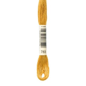 May include: A skein of embroidery floss in a golden yellow color. The label shows the number 783 and a barcode. The floss is tightly wound at the top and bottom, with a loop at the bottom.