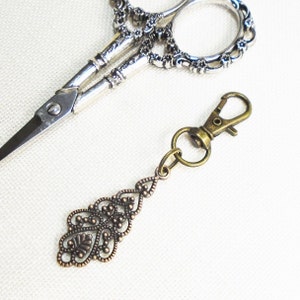 Bronze filigree zipper pull or scissor fob
