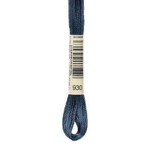 May include: A skein of blue embroidery floss, color 930, against a white background. The floss is tightly wound, with a paper label wrapped around the center. The label has a barcode and text.