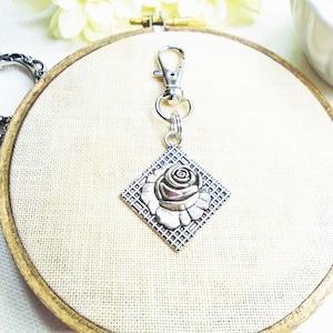 Silver flower zipper pull, scissor fob