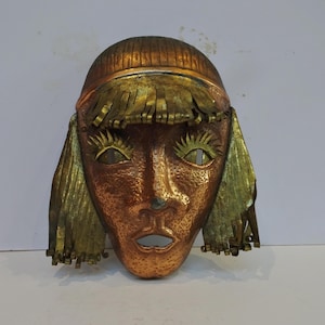 Wall art sculpture . 20th Century Copper and brass wall mask.