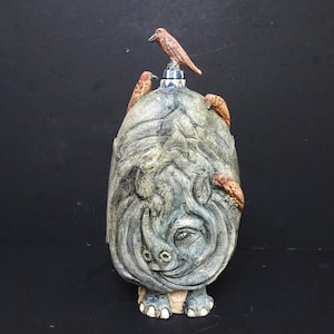 May include: A rustic wooden sign with the text "Welcome to our home" in white lettering. The sign features a distressed finish and a simple, inviting design, perfect for entryway decor.