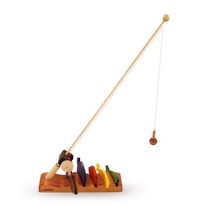Wooden fishing rod and fish