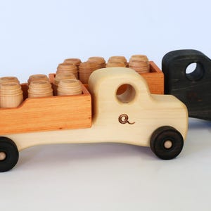 Wooden  trucks with barrels or logs
