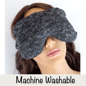 May include: A gray and black eye mask with a textured pattern. Machine Washable.