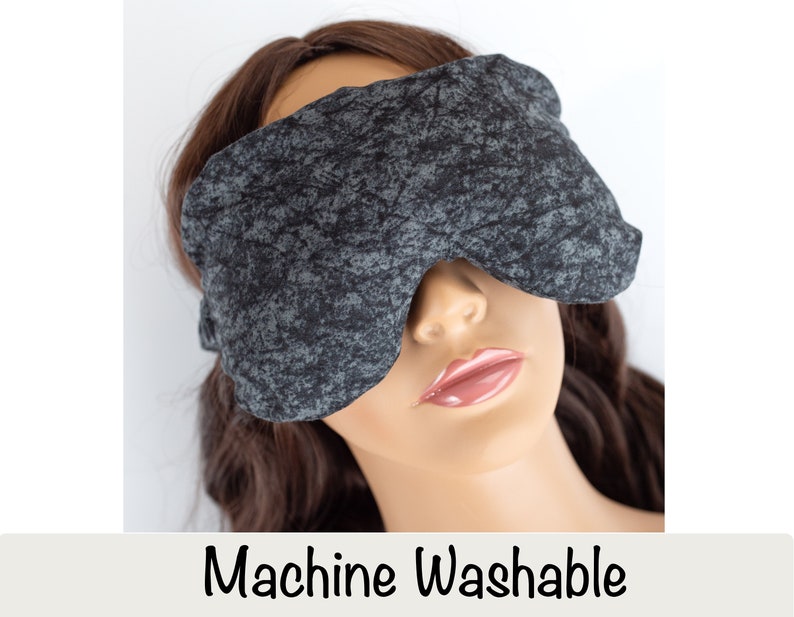 May include: A gray and black eye mask with a textured pattern. Machine Washable.