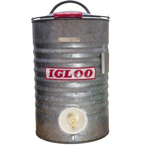 May include: A cylindrical galvanized metal water cooler with a corrugated exterior, featuring a red and white IGLOO logo on the front. It includes a top handle with a red grip, a white plastic spigot at the base, and a metal lid with a handle.